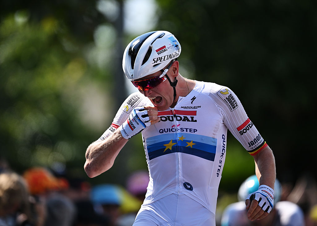 CHATEAUROUX, FRANCE - JULY 13: Tim Merlier of Belgium and Team Soudal Quick-Step celebrates at finish line as stage winner ahead of Jonathan Milan of Italy and Team Lidl - Trek - Green Sprint Jersey during the 112th Tour de France 2025, Stage 9 a 174.1km stage from Chinon to Chateauroux ) / #UCIWT / on July 13, 2025 in Chateauroux, France.