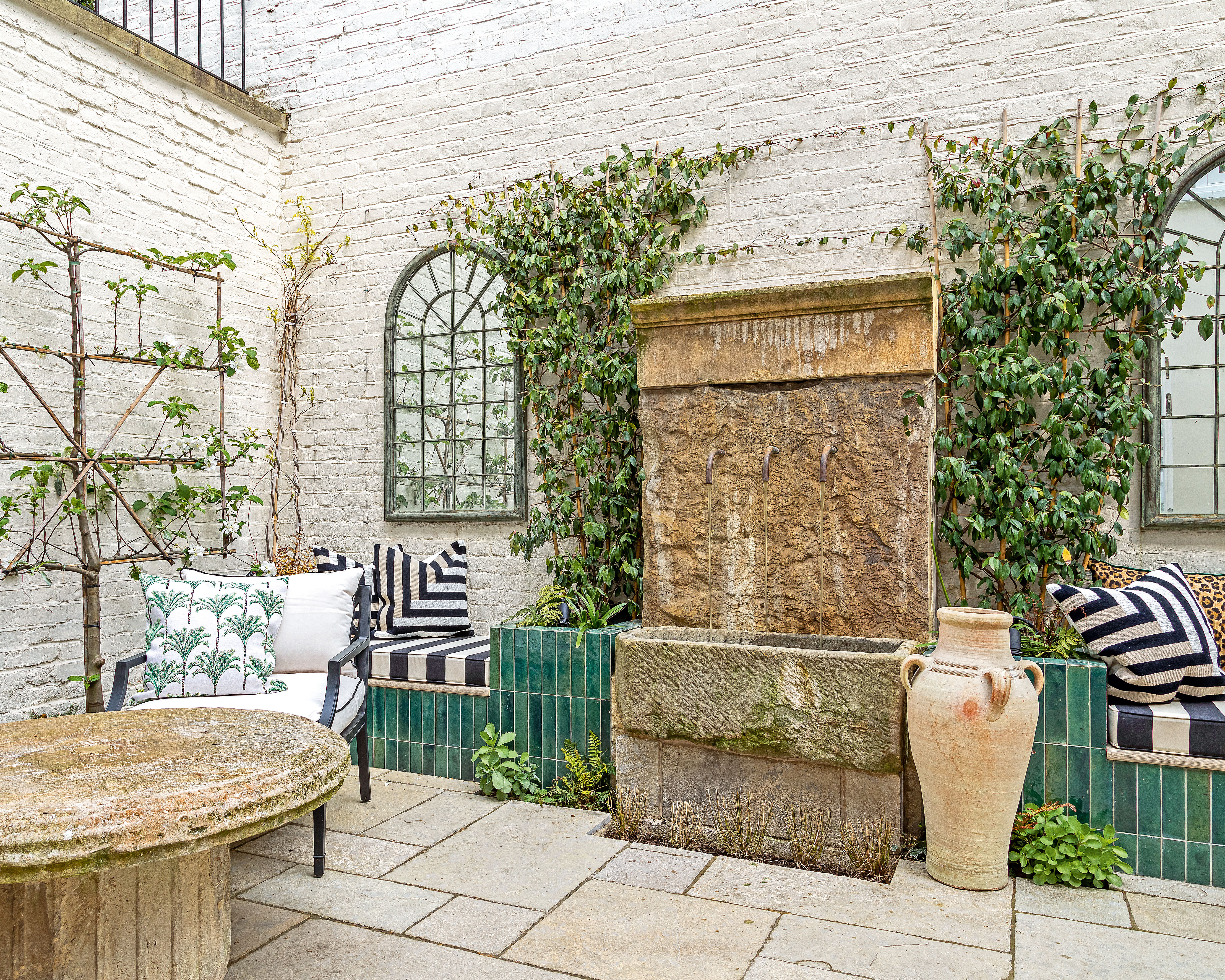 mixed materials and reclaimed stone used in a courtyard