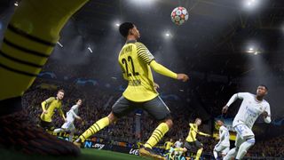 PS Plus free games for May: FIFA 22 player looking at a football in mid-air