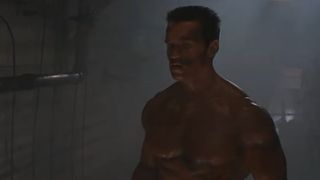 Arnold Schwarzenegger stands shirtless at the end of Commando