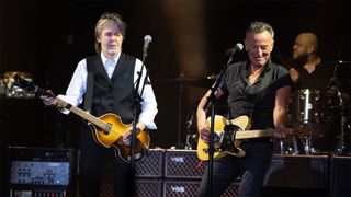 Paul McCartney and Bruce Springsteen performing together during McCartney's 2022 Glastonbury Pyramid Stage set
