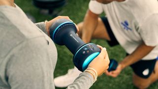 Therabody CryoTherm Palm in use