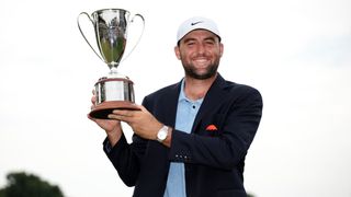 Scottie Scheffler with the Travelers Championship trophy