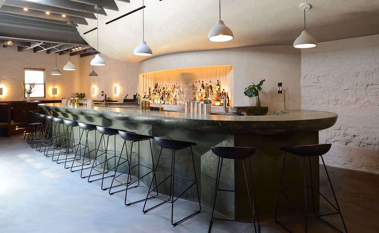 Green leathered quartzite and concrete bar at Bar Beau, New York City, USA