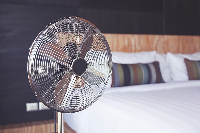 A fan in a bedroom.