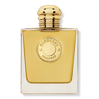 Burberry Goddess Eau De Parfum Intense in gold rectangular bottle with circular metallic gold embossed label and reflective gold cap on light grey background