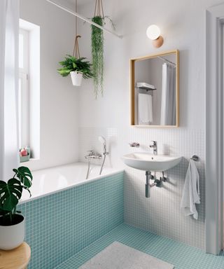 bathroom with turquoise floor tiling extending onto bath panel