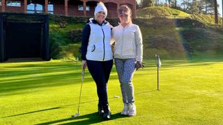 Carly Cummins and friend Anne on the golf course