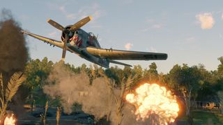 Enlisted: Reinforced screenshot - F6F Hellcat fighter bombing a battlefield from low altitude