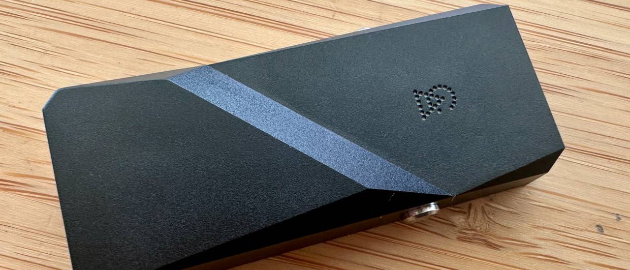Campfire Audio Relay headphone DAC on a wooden surface