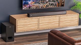 Hero image of Majority Sierra 2.1.2 soundbar and subwoofer in a lifestyle setting with TV, cabinet, and sofa.