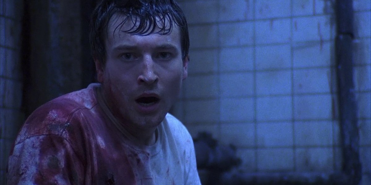 Leigh Whannell shocked and bloody in Saw 2004