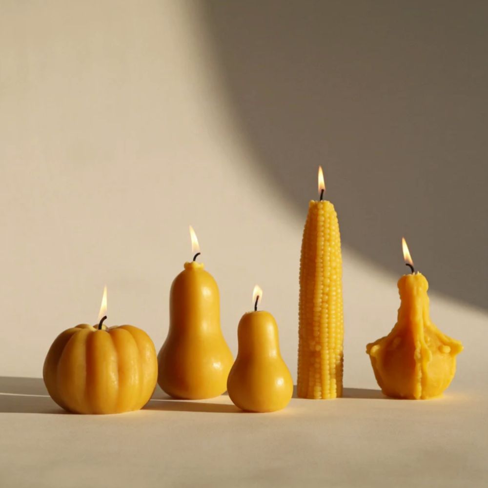 set of yellow candles in the shape of harvest vegetables