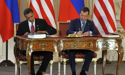 Obama and Medvedev sign a groundbreaking nuclear treaty.
