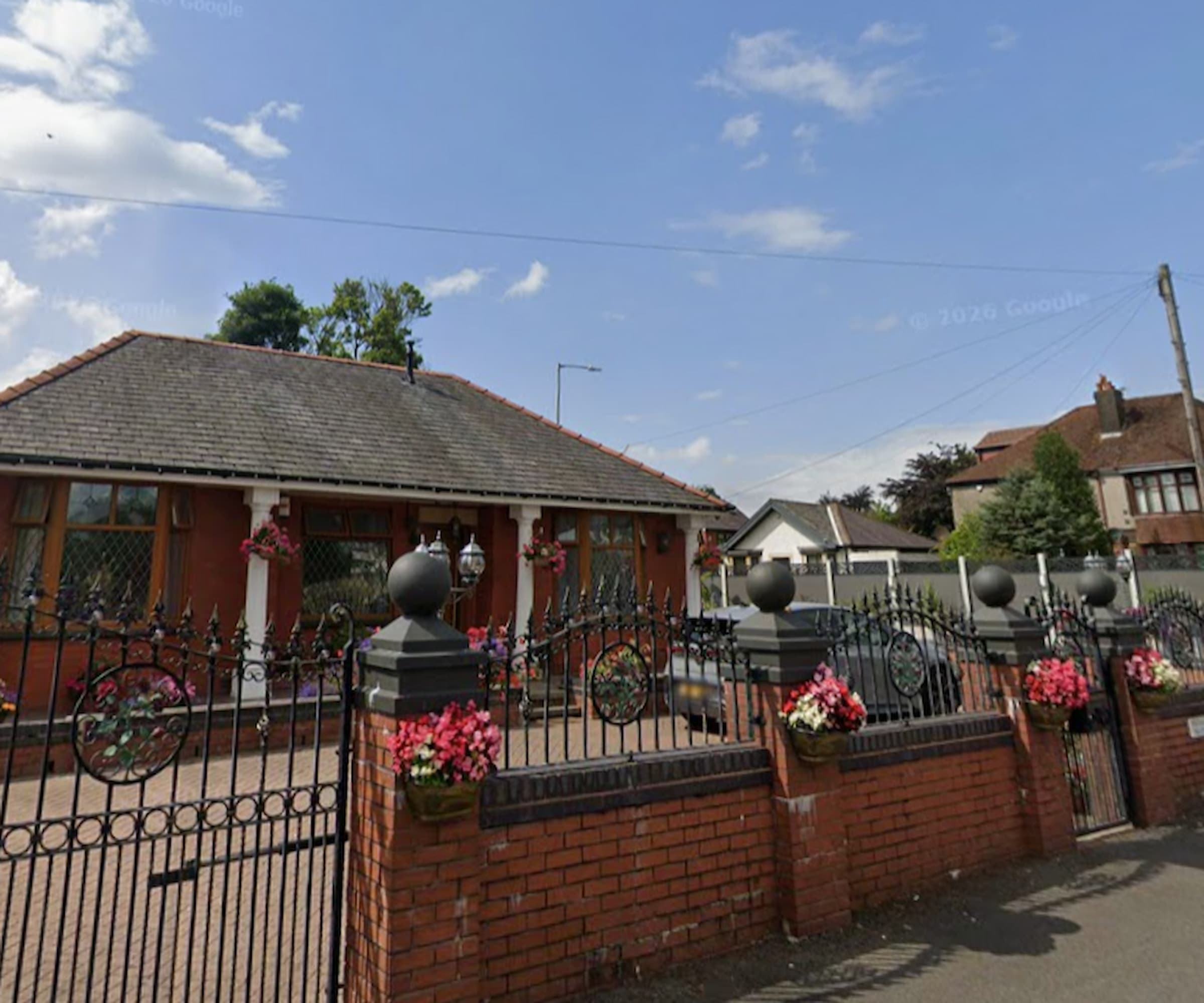 A fence and a brick wall