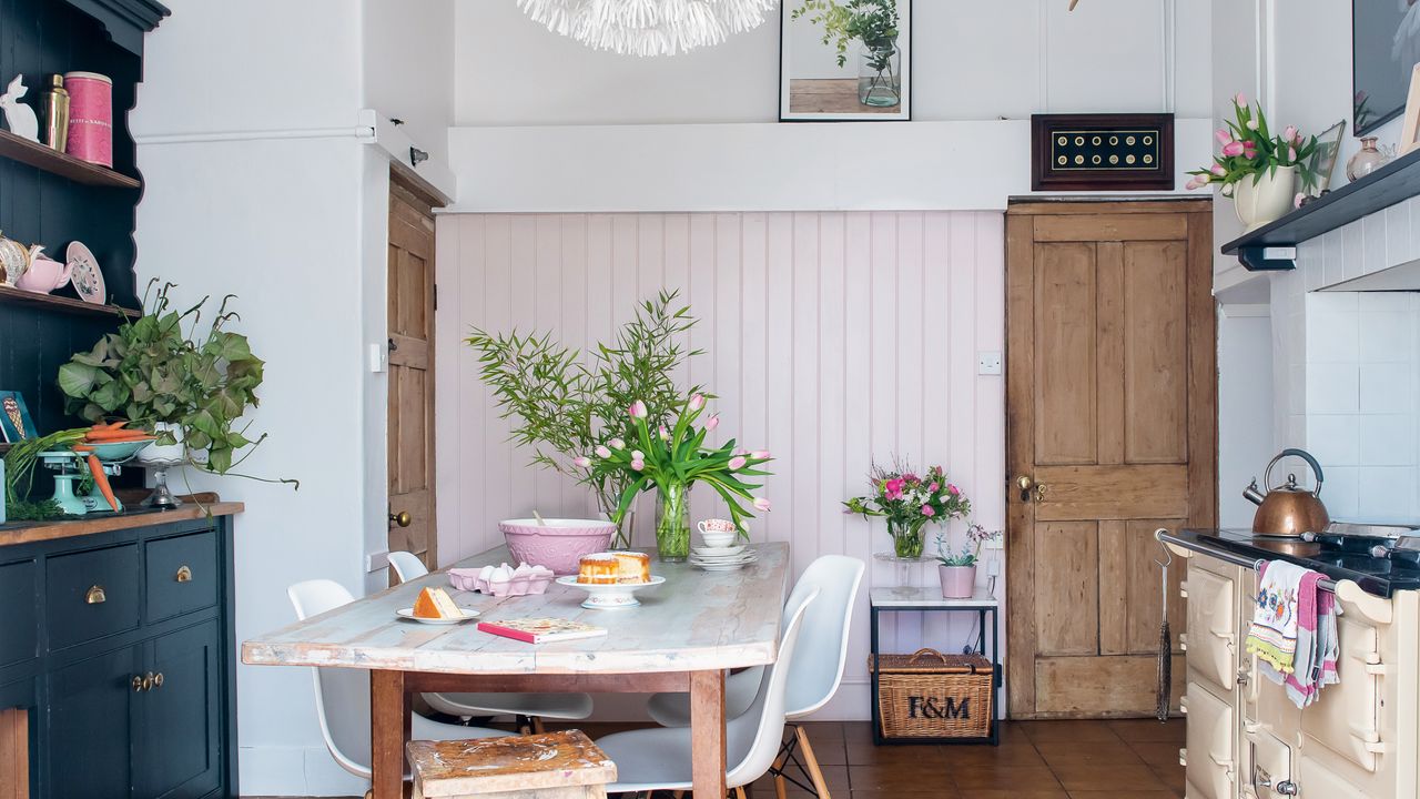 kitchen with dark painted dresser and aga in a part Victorian part Georgian home