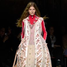 a model on the aw26 runway wearing voluminous clothes