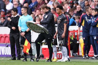 Ethan Nwaneri of Arsenal waits to be substituted on during the Premier League match between Brentford FC and Arsenal FC at Brentford Community Stadium on September 18, 2022 in Brentford, United Kingdom.