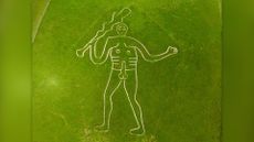 An aerial view of the Cerne Abbas Giant, on August 22, 2023 in Cerne Abbas, England. The Cerne Abbas Giant hill figure is situated near the village of Cerne Abbas in Dorset, it stands 55 metres high, depicting a standing nude male with a prominent erection and wielding a large club and is listed as a scheduled monument of England.