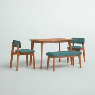 Four piece dining tale set in warm wood and blue upholstery 