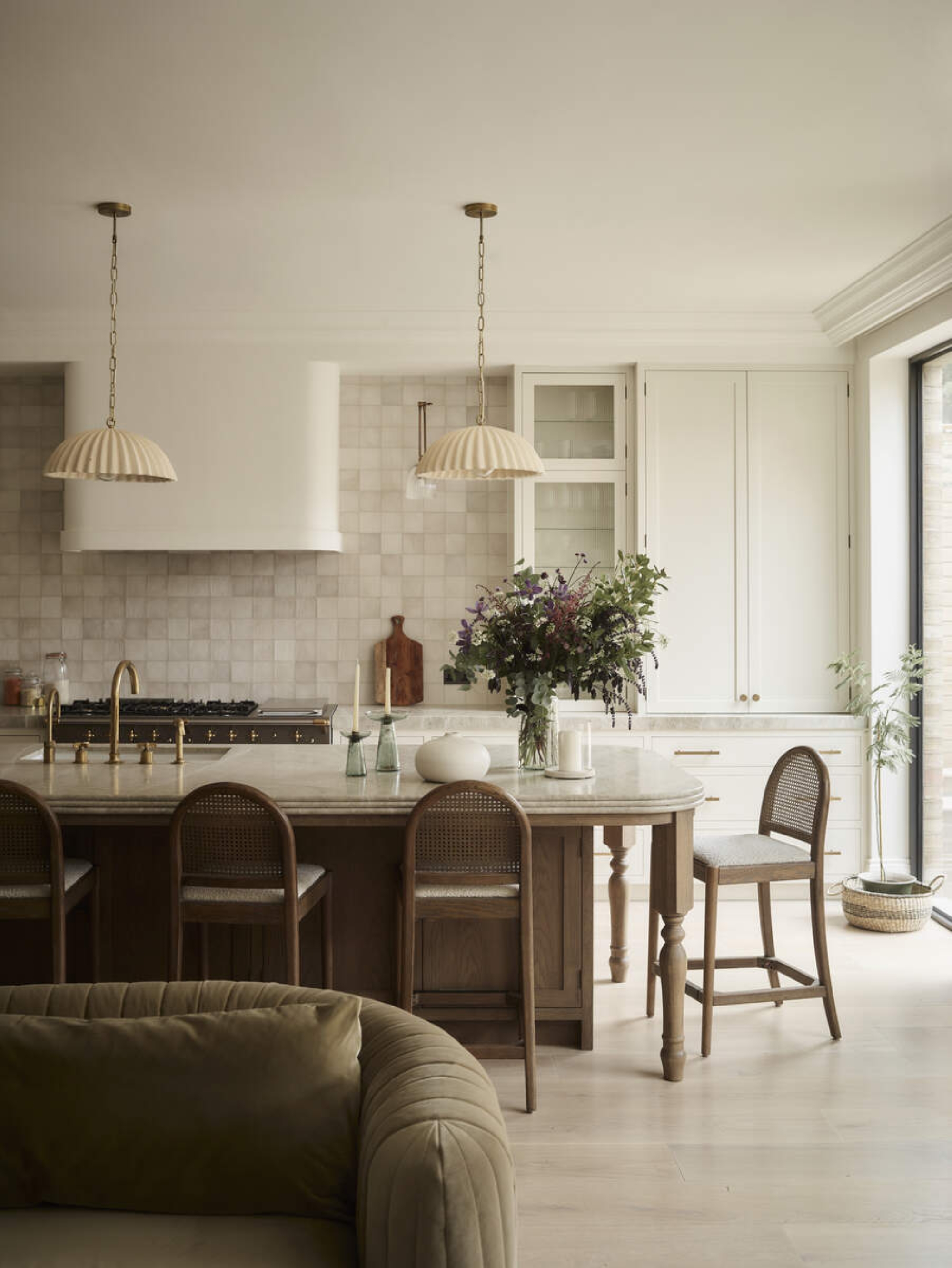 modern neutral kitchen white a white tiled backsplash and wooden island with beige counters