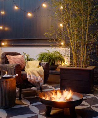 outdoor seating area with lightbulbs firepit