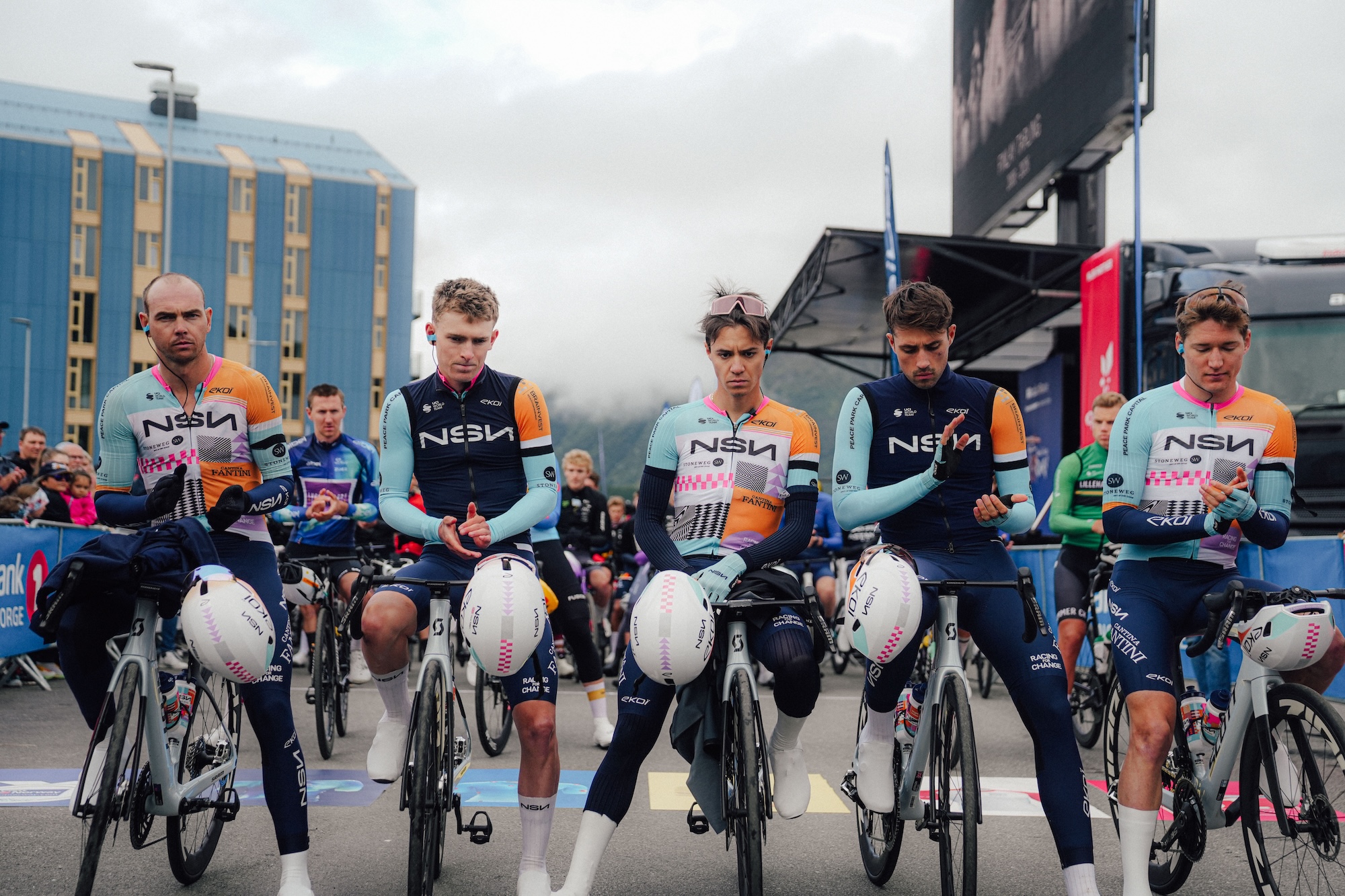 NSN riders lined up ahead of the peloton to honour Finlay Tarling at the start of stage 3 of Arctic Race of Norway