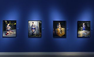 The exhibition is mounted on an intense blue backdrop. Courtesy Fondazione Bisazza