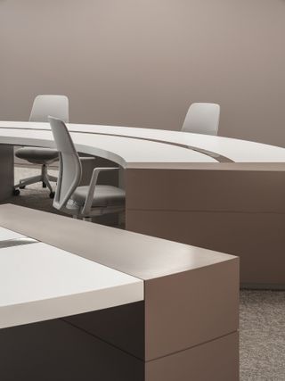 A circular desk and office chairs