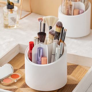 Rotating makeup brush storage