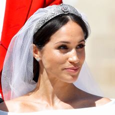 windsor, united kingdom may 19 embargoed for publication in uk newspapers until 24 hours after create date and time meghan, duchess of sussex travels in an ascot landau carriage as she prince harry, duke of sussex begin their procession through windsor following their wedding at st georges chapel, windsor castle on may 19, 2018 in windsor, england prince henry charles albert david of wales marries ms meghan markle in a service at st georges chapel inside the grounds of windsor castle among the guests were 2200 members of the public, the royal family and ms markles mother doria ragland photo by max mumbyindigogetty images