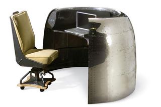 Desk made from parts of an antique DC-6 Cowling Airplane.