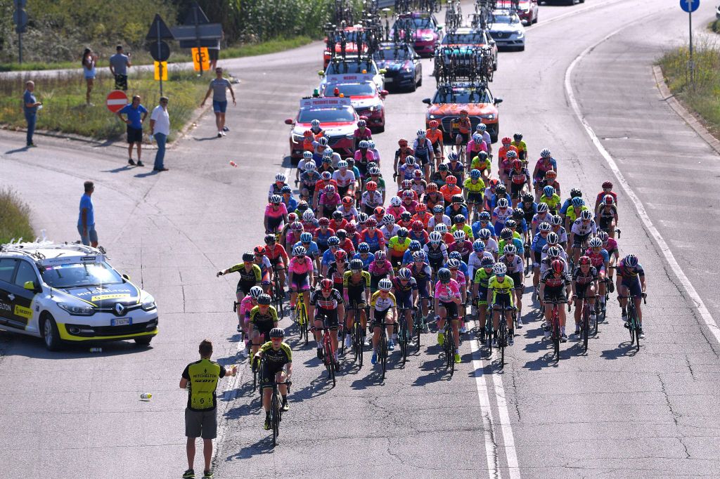 ASSISI ITALY SEPTEMBER 13 Annemiek Van Vleuten of The Netherlands and Team Mitchelton Scott Pink Leader Jersey Peloton Cecilie Uttrup Ludwig of Denmark and Team FDJ Nouvelle Aquitaine Futuroscope Green Mountain Jersey Emma Norsgaard Jorgensen of Denmark and Team Paule Ka White Best Young Jersey Peloton Feed Zone Soigneur during the 31st Giro dItalia Internazionale Femminile 2020 Stage 3 a 1422km stage from Santa Fiora to Assisi 413m GiroRosaIccrea GiroRosa on September 13 2020 in Assisi Italy Photo by Luc ClaessenGetty Images