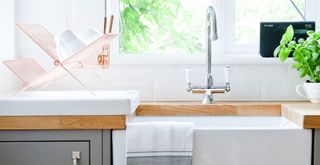white ceramic butler sink in gray kitchen