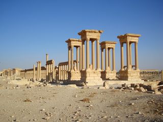 Most of the towering columns of Palmyra's Tetrapylon, shown in the foreground here, are now demolished.