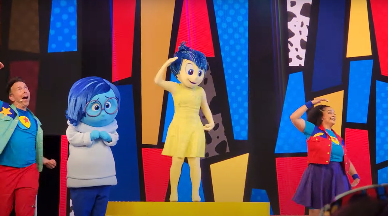 Joy and Sadness dancing at Pixar Pals Playtime Party at Disneyland