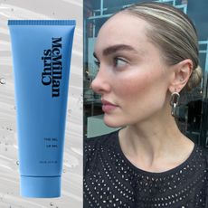 a woman with blonde hair wearing a slick back bun 