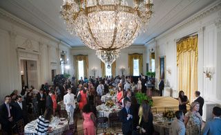 The vibe in the East Room, the largest in the White House, was simultaneously regal and summery. Chief floral designer Laura Dowling conjured garden-style bouquets at each of the round tables...