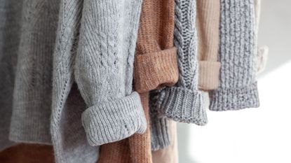 Wool sweaters hung up on a rail