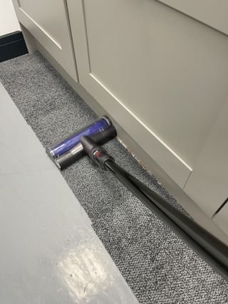Dyson V12 Detect Slim vacuuming carpet edges