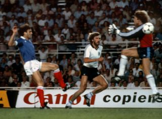 West Germany goalkeeper Harald Schumacher goes past the ball before colliding with France's Patrick Battiston in a controversial incident at the 1982 World Cup.