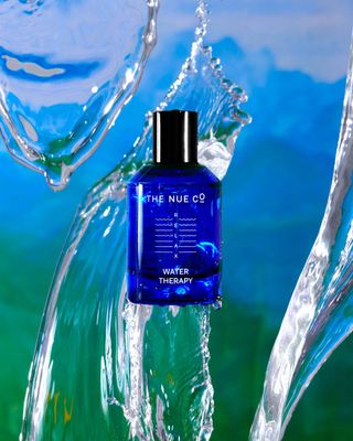 Nue Co Water Therapy functional fragrance in bright blue glass bottle