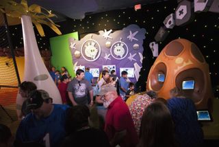 Visitors Try Out Angry Birds Space Encounter Exhibit
