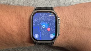 An Apple Watch Ultra on a wrist showing maps
