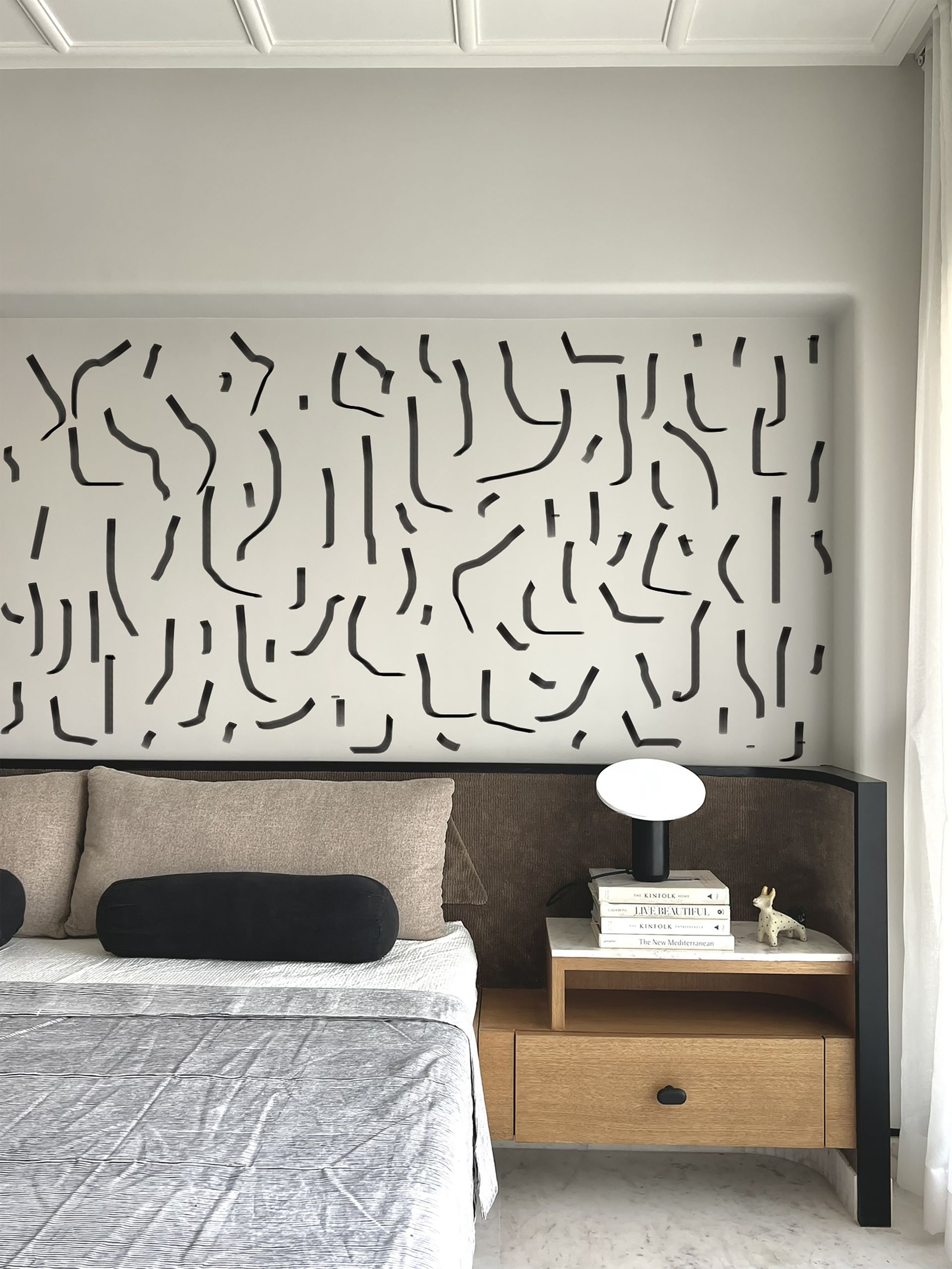 A bedroom with different types of pillows