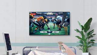 A new Samsung display showing a football game in a a hospital room.