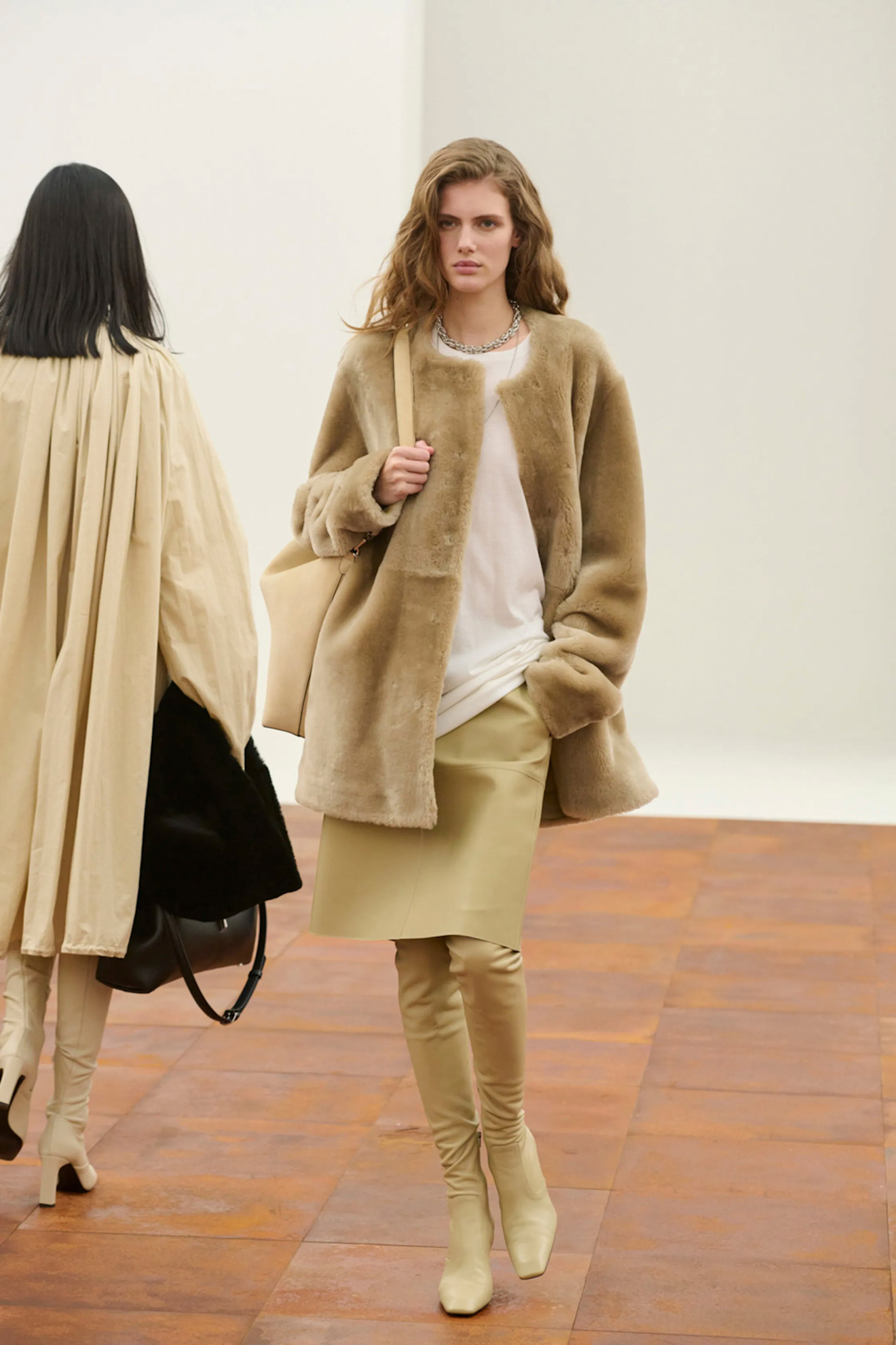 An image of glove-fit boots on the Toteme autumn/winter 2025 runway.