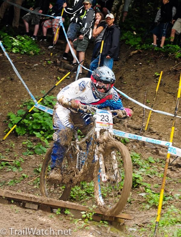 Nicole Beege flying off of a wooden platform.