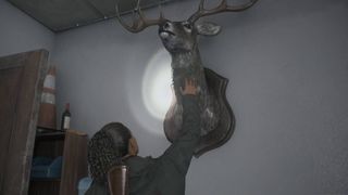 Alan Wake 2 Saga petting deer head