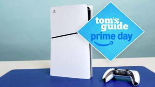 A Sony PS5 Slim console on a table with a Tom's Guide Prime Day badge on top